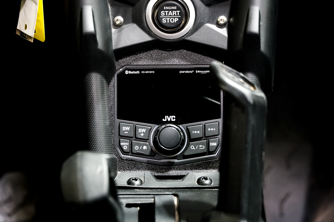 JVC KD-MR1BTS digital media receiver installed in vehicle center console below engine start stop button